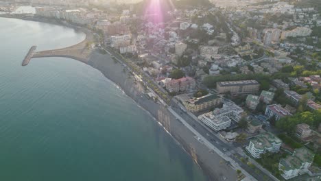 drone flying over the city by the beach