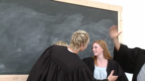 group of teenagers celebrating after graduation