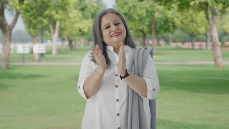 Happy-Indian-mother-clapping-and-appreciating-in-park