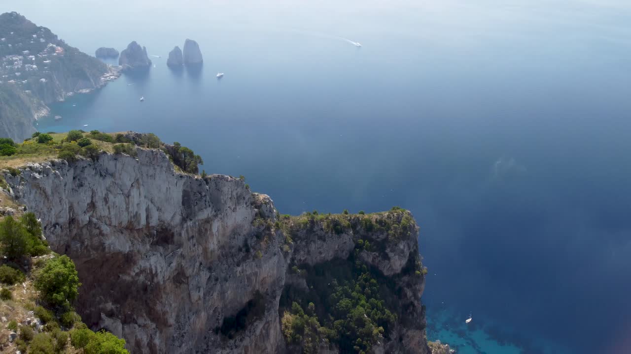 Aerial - Tilt-down view of Faraglioni from mount Solaro, Capri, Italy