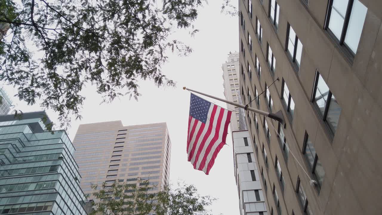 Slow Motion of American Flag on Building in Downtown Manhattan, New York USA