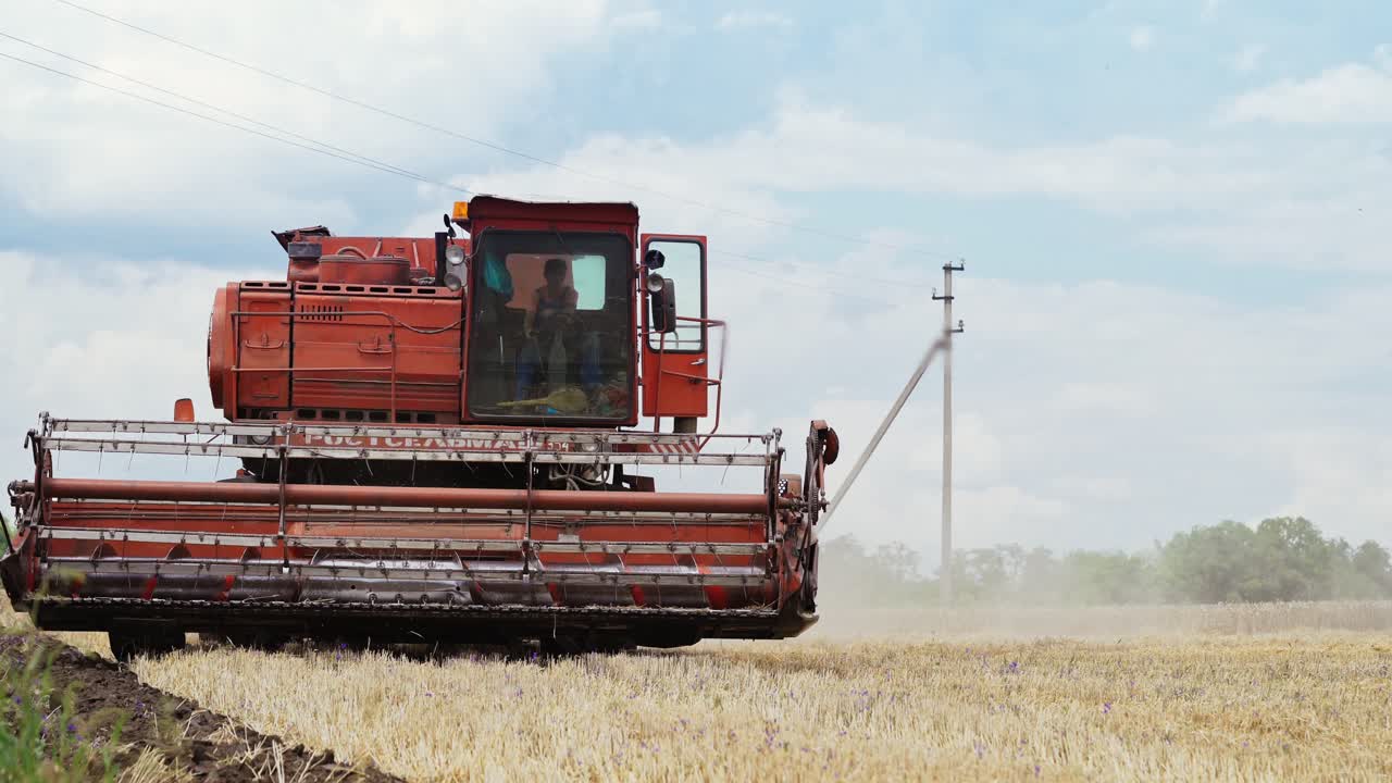 Harvest time. Combine harvester working in a wheat field