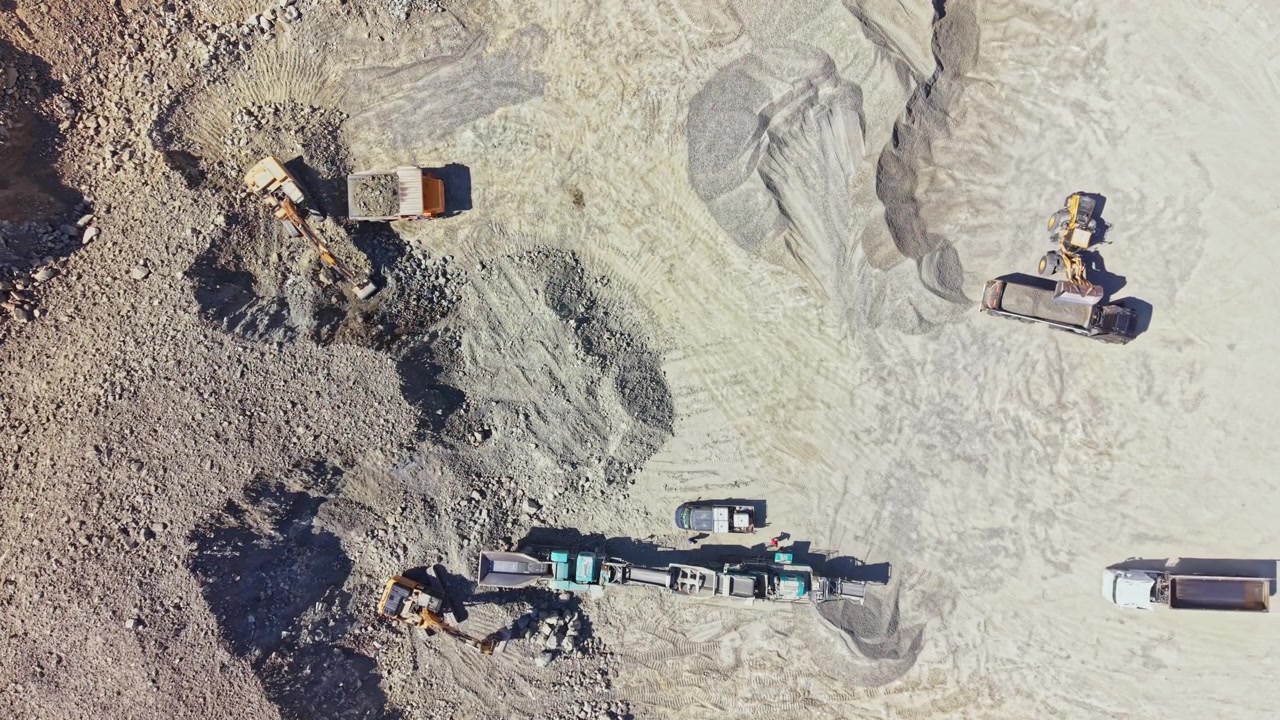 Granite quarry with heavy machinery working in an active site