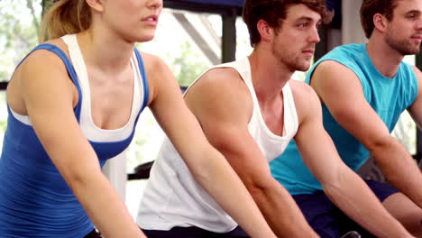 Fit-group-of-people-using-exercise-bike-together