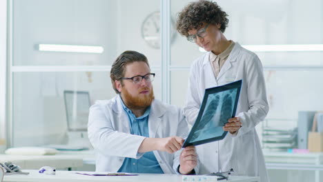 male and female doctors discussing x ray