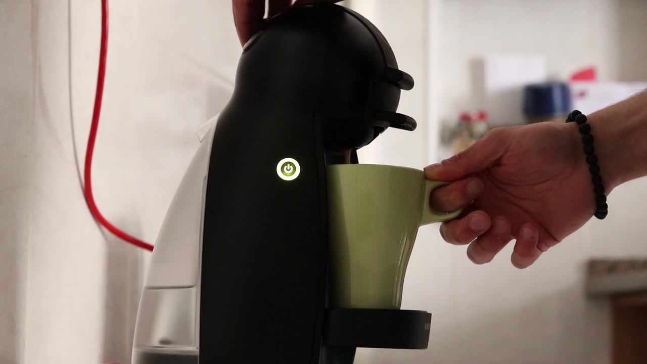 Man making coffee with a coffee machine, part two