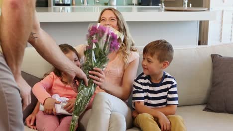 happy family sitting on the sofa