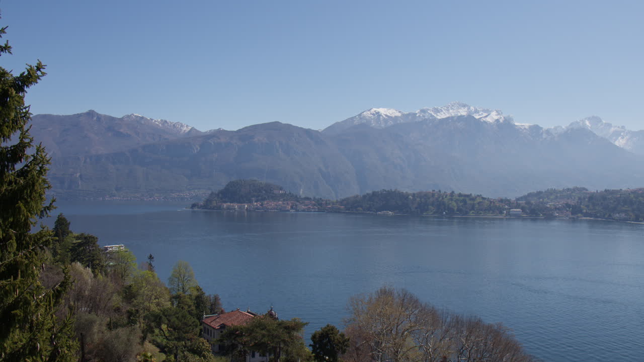Calm Scene Of Lake Como Overlooking Bellagio Village In Italy. Wide Shot