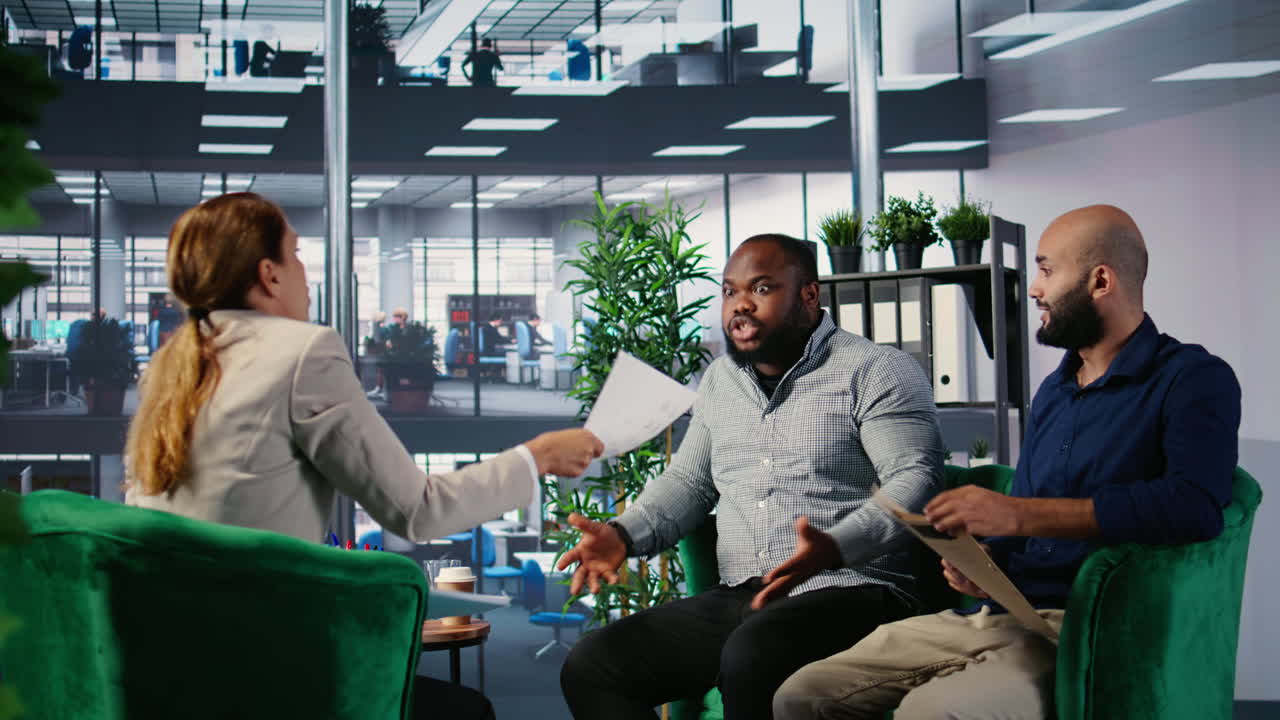 Vertical Video Multiethnic professionals in a heated argument during corporate negotiation