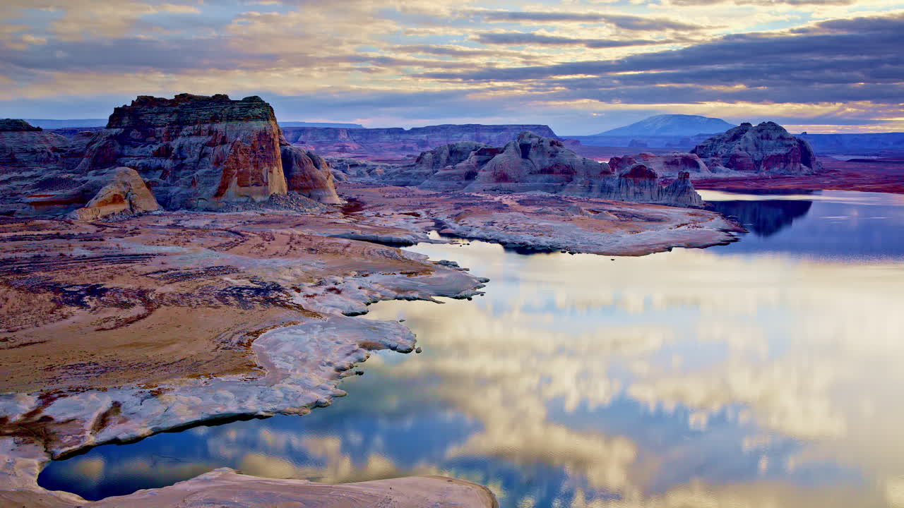 Sureal drone shot showcasing lake powell and the strange and fascintatin rock formations near Page Arizona