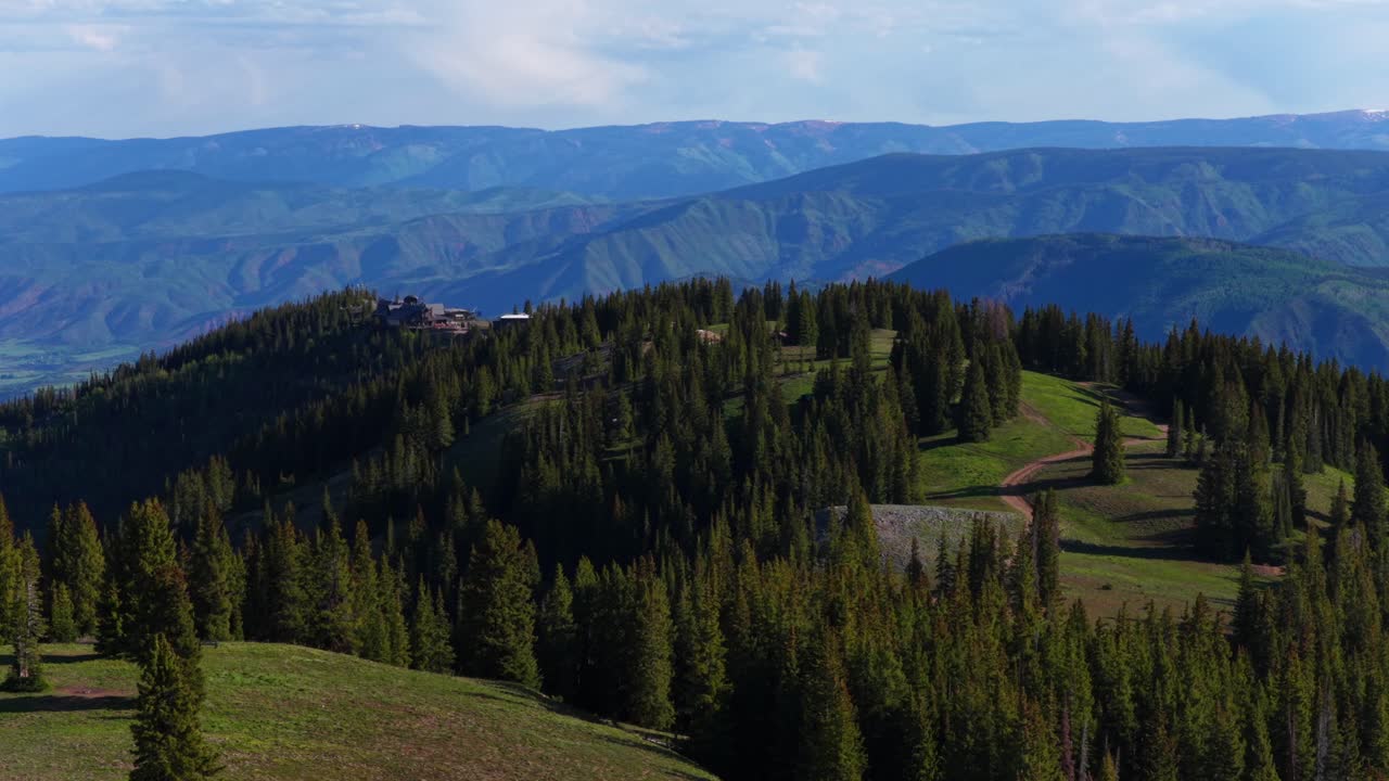 Aspen Gondola Little Annie Basin Trailhead AJAX top of Aspen Mountain aerial drone melting snow Rocky Mountains spring summer morning sunny blue sky Silver Bell Trailhead Richmond Hill circle right
