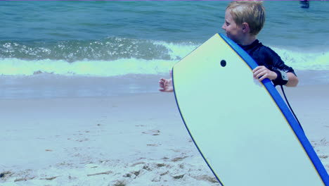 A-boy-on-a-beach-gestures-and-makes-faces