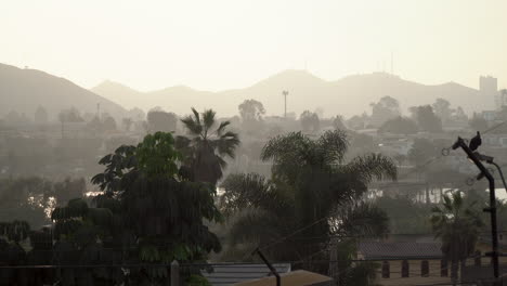 Sunset-over-the-mountains-and-a-lake-in-Lima,-Perú