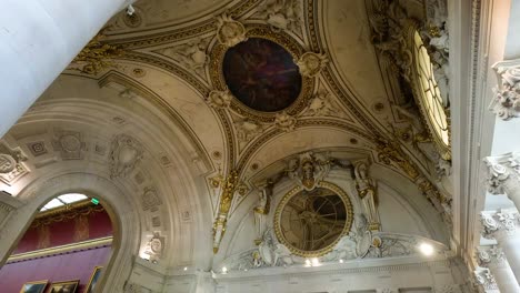 visitors admire ornate ceilings and grand architecture