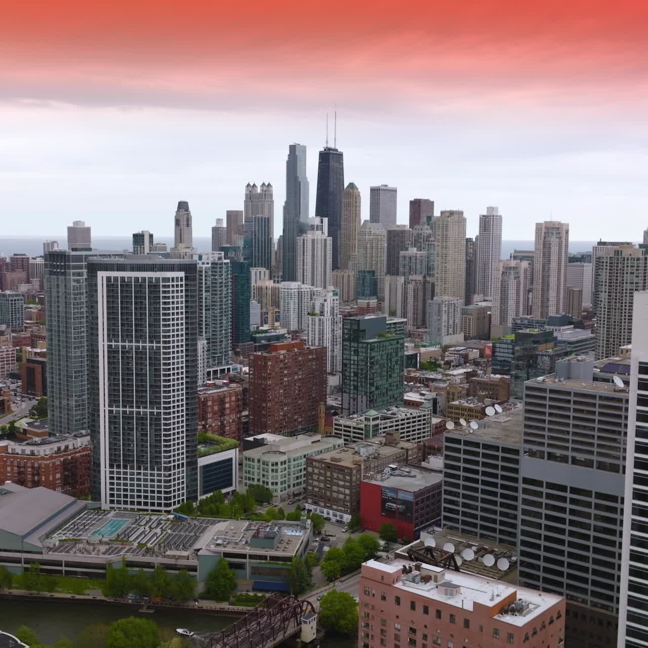 Varied architecture of amazing Chicago at sunset. Beautiful skyscrapers at the backdrop under pink skies