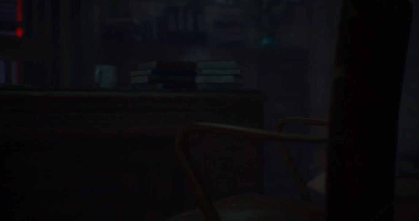 A darkened study with a desk books and a coffee cup at night