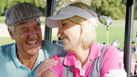 Two-golfers-driving-in-their-golf-buggy-