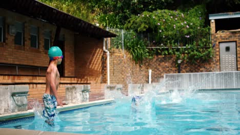 cute little kids jumping in the swimming pool