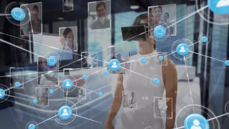 Animation-of-network-of-connections-with-icons-over-businesswoman-wearing-vr-headset