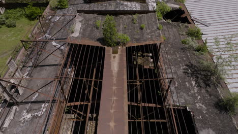 fly over rusted roofs of abandoned industrial site in khashuri, georgia