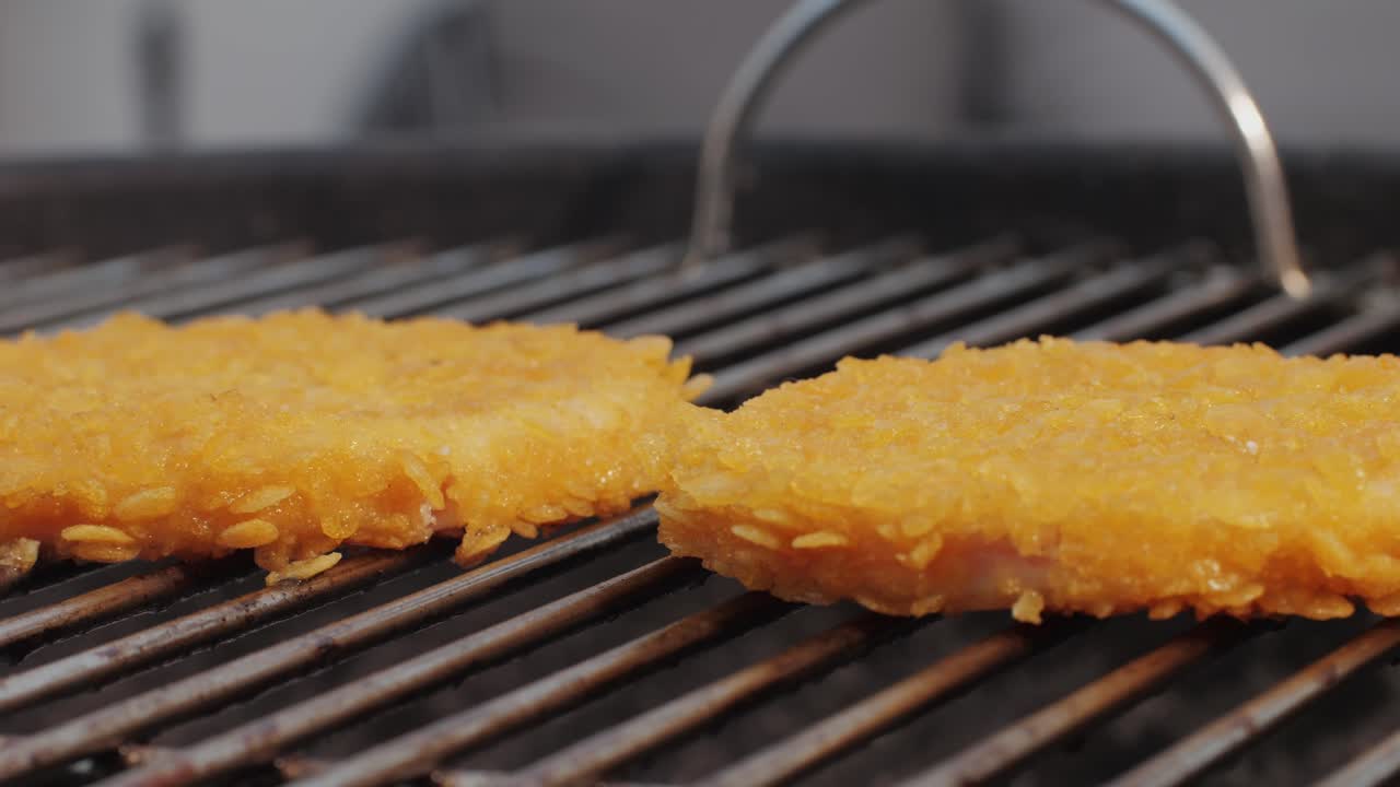Veggie orange burger on grill, carrot and oats burger with corn and yellow pepper, vegetarian food barbeque, potato grill burger.
