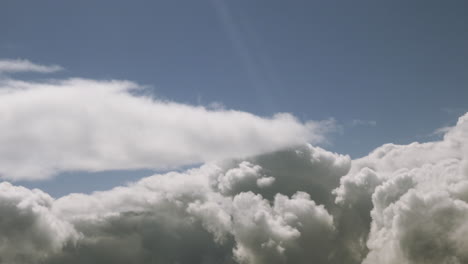 thick dense clouds in deep blue sky