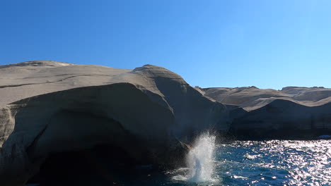 High-cliff-over-the-Mediterranean-Sea,-a-young-diver-is-doing-a-dods,-death-diving,-Greece