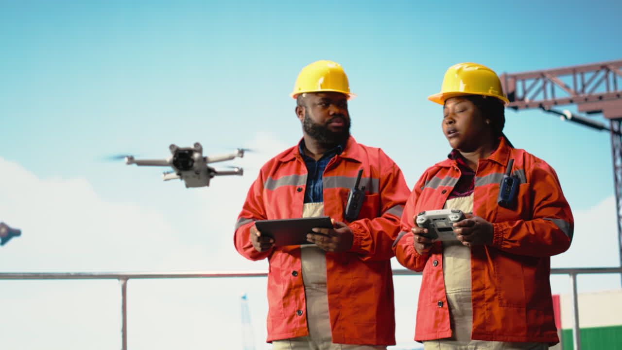 Vertical video Drilling rig engineering team using drone to access dangerous areas