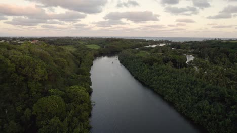 dramatic aerial footage of famous wailua river during sunset, sunrise