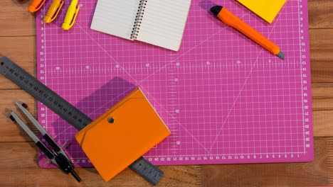 animation of notepad and craft tools on pink craft mat