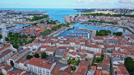 seen on the famous city of la rochelle with in the background the famous chain and st nicolas towers