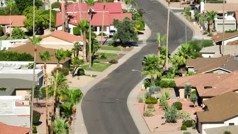 rivian r1t driving through residential neighborhood in arizona