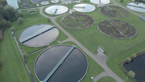 Beautiful-aerial-of-reflecting-water-basins-of-a-water-treatment-plant