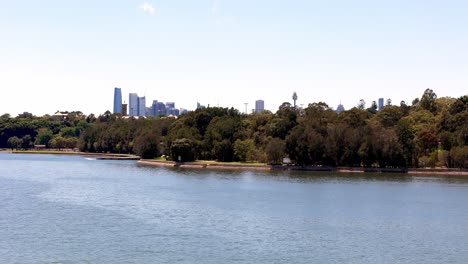 Expansive-city-skyline-with-iconic-bridge,-A-panoramic-view-from-a-suburban-vantage-point