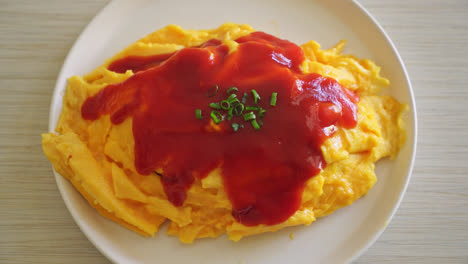 Flavored-Fried-Rice-in-an-Omelet-Wrapping-or-Omurice-in-Japanese-style---Asian-food-style