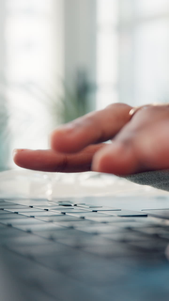 Close Up of Hands Typing on Laptop Keyboard