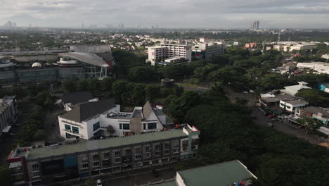 Traffic-At-Roundabout-With-View-Of-Modern-Buildings-In-West-Java,-Indonesia