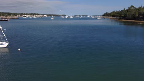 drone hovering over the southwest harbor in maine