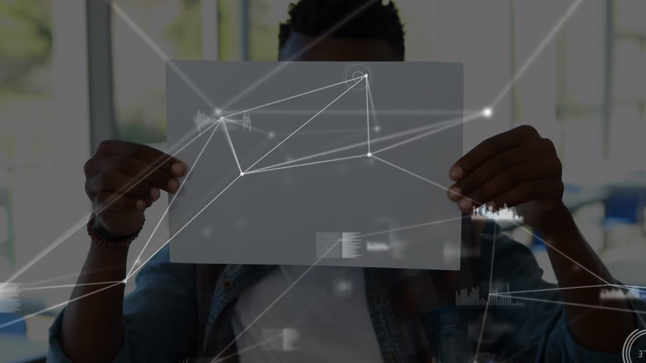 Animation of network of connections over african american male student with card