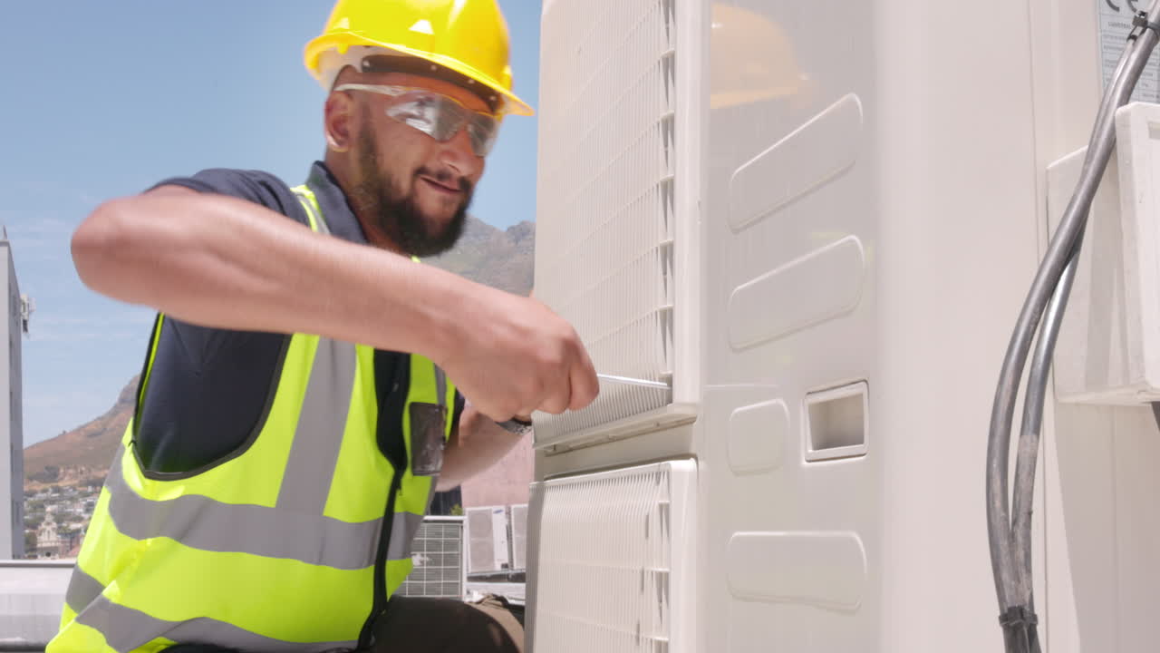 Technician man on roof for air conditioner