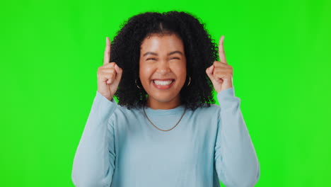 Woman,-excited-and-pointing-up-on-green-screen