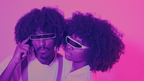 futuristic duo with afro hair and neon glasses in pink light