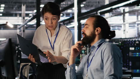 vertical video data center admins working together, collaborating on ai software development