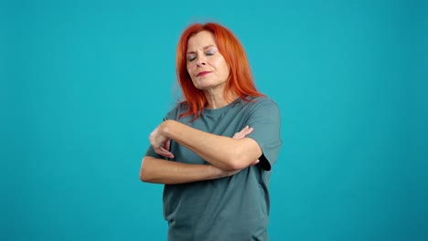 serious woman with crossed arms looking at camera