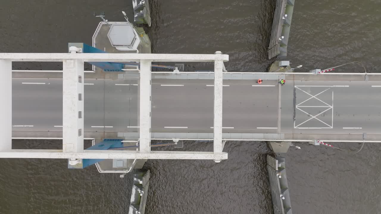True overhead shot capturing the bridge deck, control huts and fender system at a canal crossing