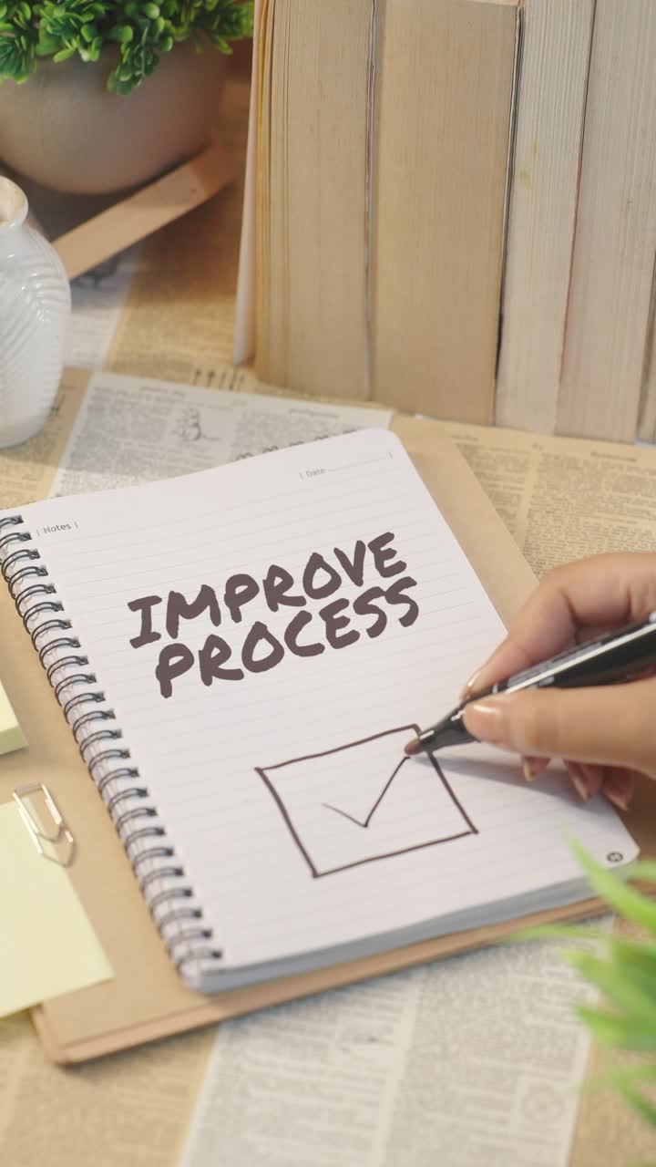 VERTICAL VIDEO OF TICKING OFF IMPROVE PROCESS FROM CHECKLIST