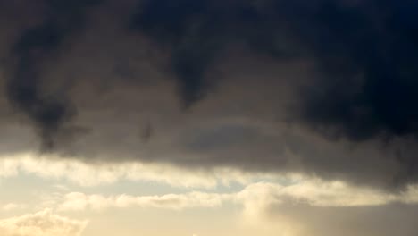 dark and dramatic storm cloud area background. time lapse. epic storm tropical clouds at sunset. timelapse 4k uhd.