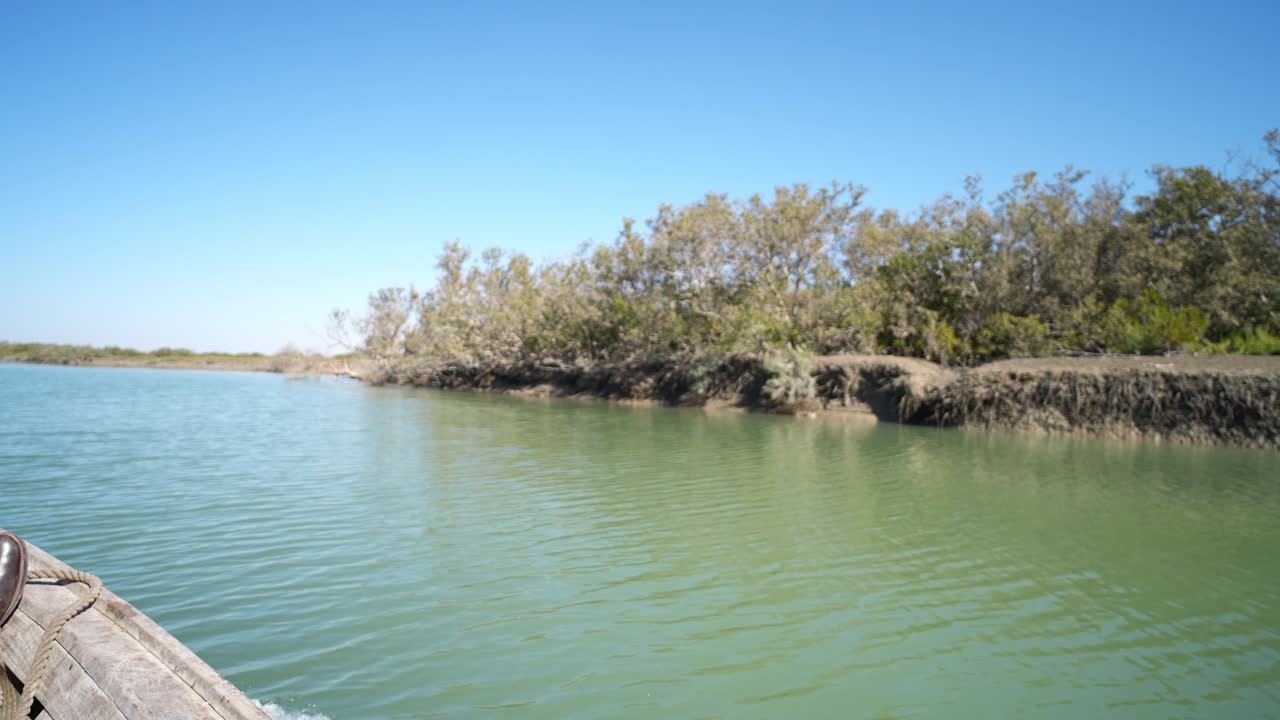 calm boat view along mangrove water channel in coastal Balochistan Pakistan