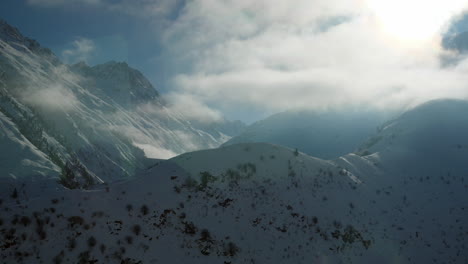 Window-view-from-Glacier-Express-route-in-Switzerland-of-snow-capped-mountains