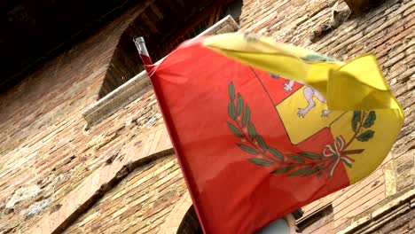 old town in italy and the flag of the province in italy.